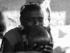 Tribal man drinking beer near Key Afar